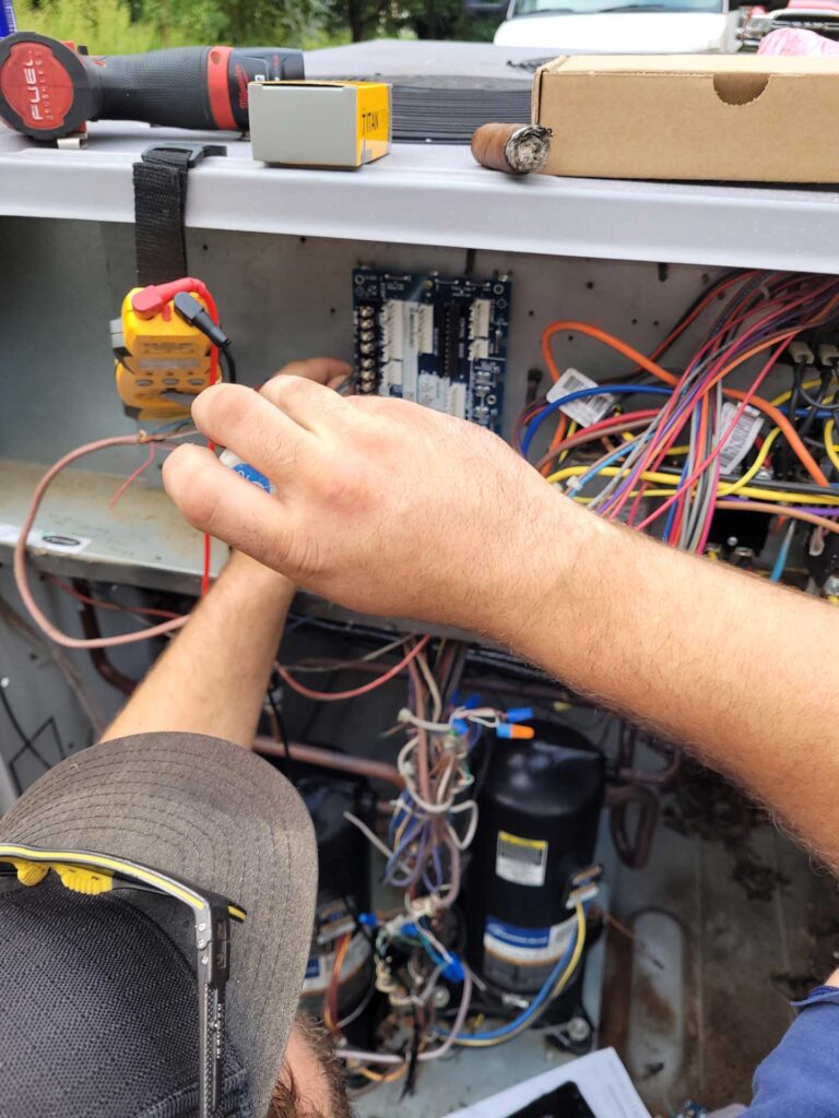 HVAC technician working on a unit