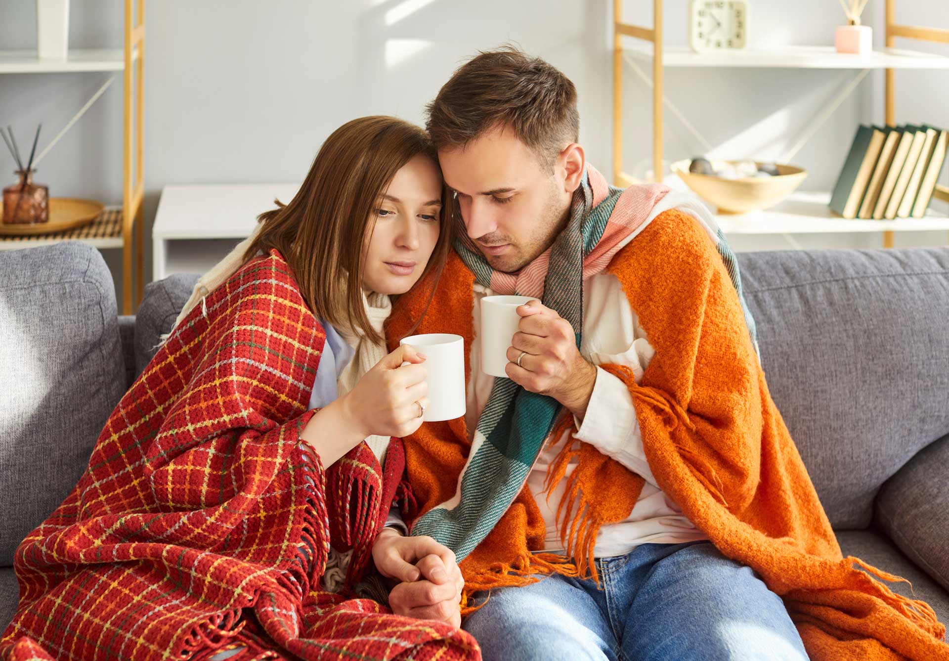 Cold family wrapped in blankets because their heater isn't working