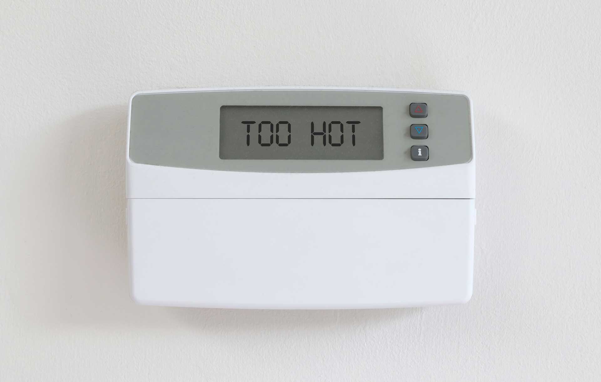 Thermostat with the message "TOO HOT" because the HVAC is broken